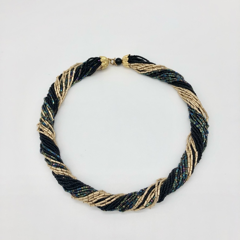 Necklace from beads rope gold, black and blue-iridescent . Length 18”
